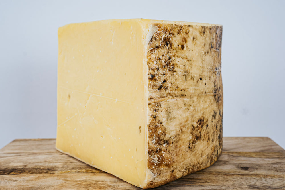 
            
                Load image into Gallery viewer, Quickes English Cheddar 18mth Cloth Bound Cave Aged
            
        